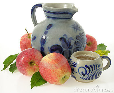 Earthen Jug And Cup With Sweet Cider Decorated With Apples 