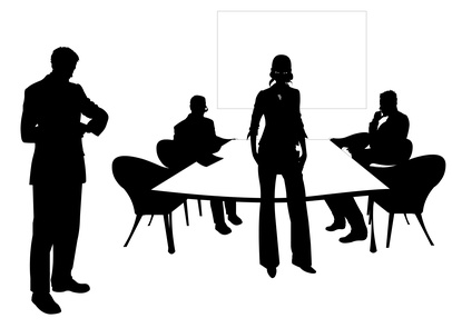 Silhouettes Of People Sitting Around A Table In A Meeting