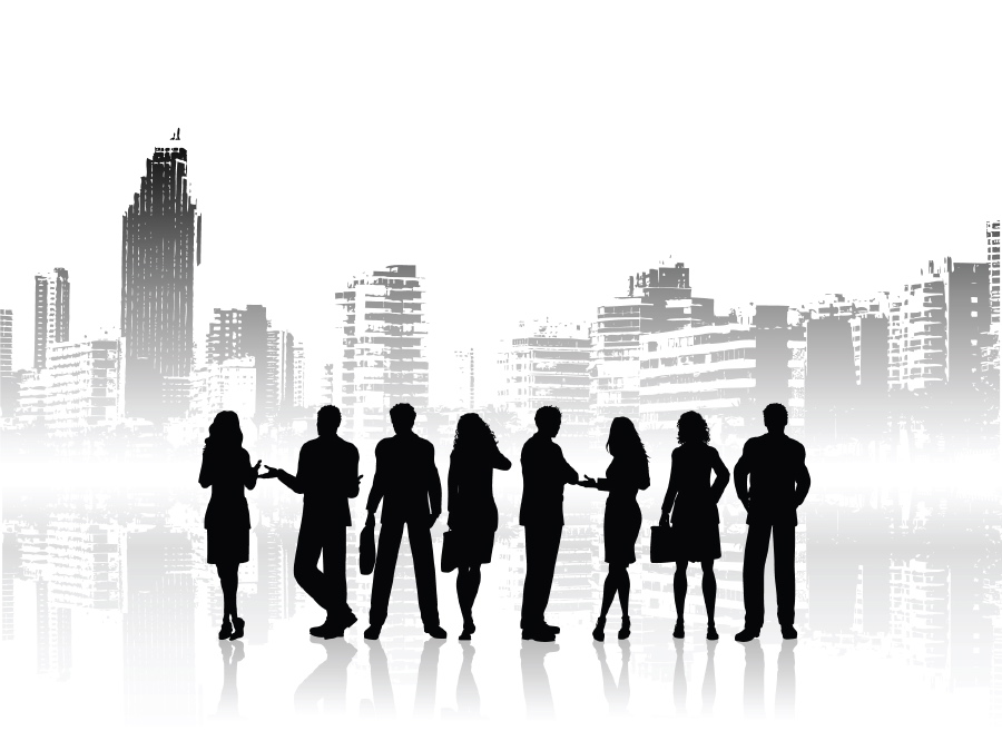 Group Of Business People In Silhouette Against City Skyline