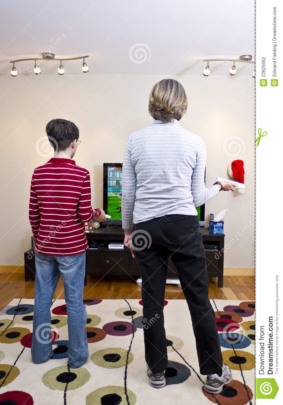 Grandmother Playing Video Games With The Nintendo Wii Gaming System