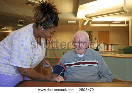     Nursing Staff Checking Blood Pressure Of Nursing Home Resident 2508472