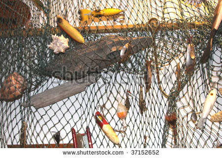 Stock Photo Fishing Net Full Of Vintage Fishing Lures And Driftwood