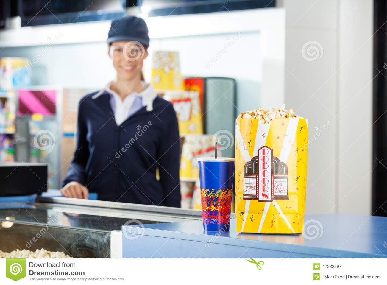 Concession Stand At Cinema With Female Worker Standing In Background