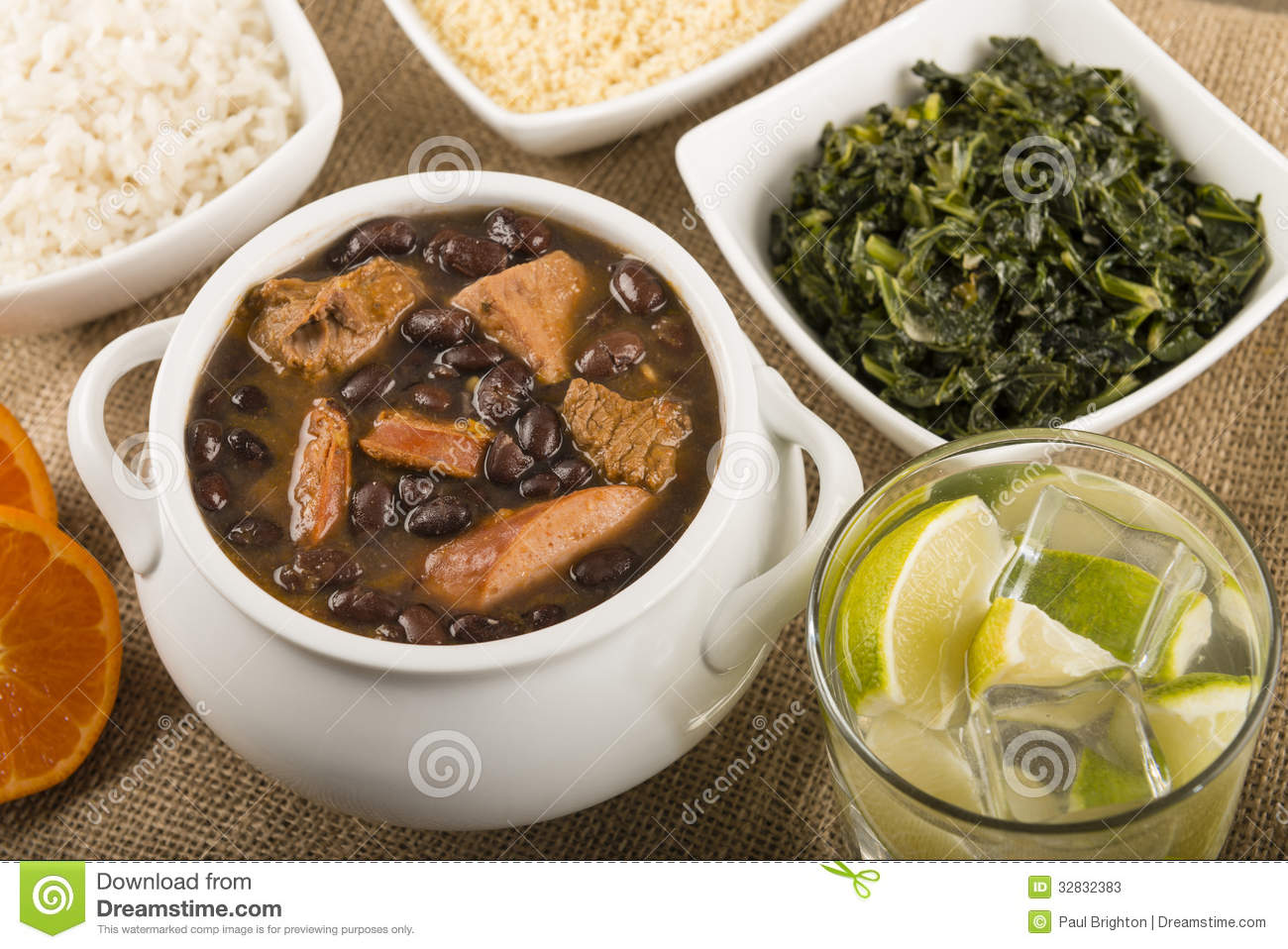 Black Bean Stew Served With Manioc Flour Kale White Rice And Oranges