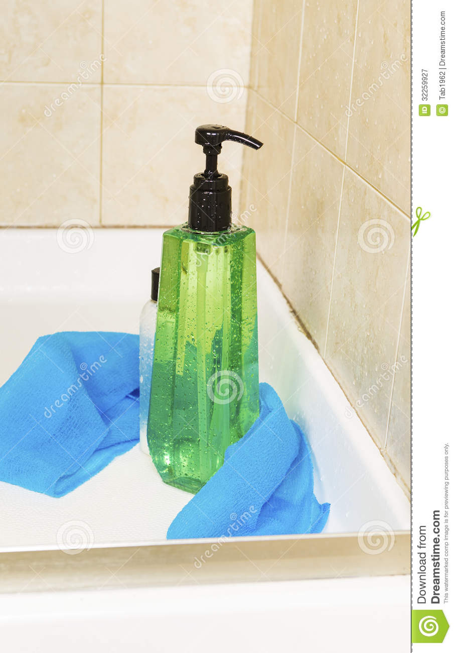 Green Shower Gel Bottle With Water Drops Wash Cloth And A Small Bottle