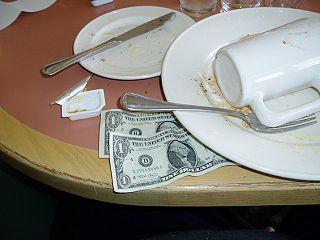 Restaurant Table Is A Common Way Of Giving A Tip To The Serving Staff