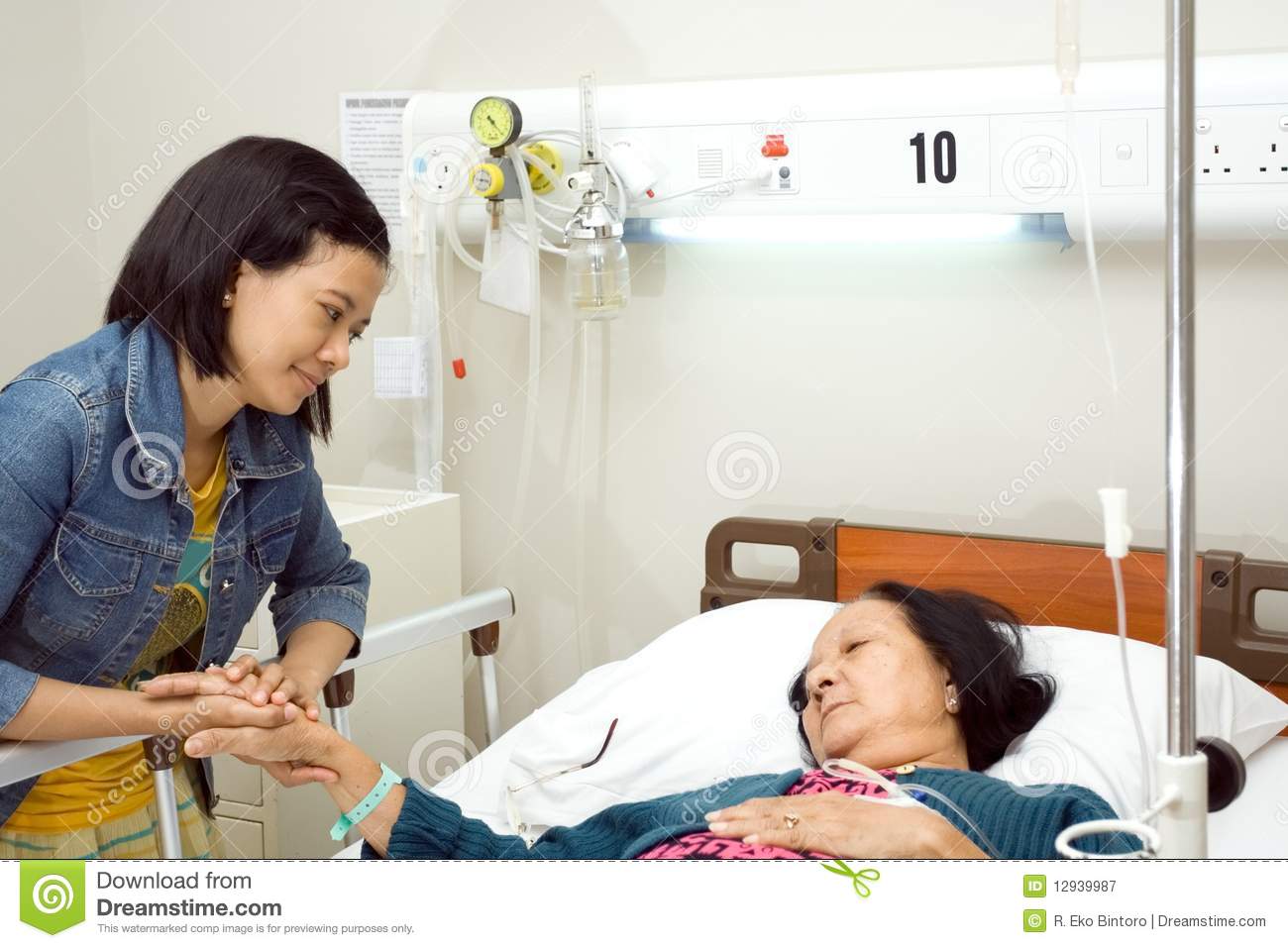 Asian Granddaughter Visit Her Sick Grandmother Having Bed Resting In
