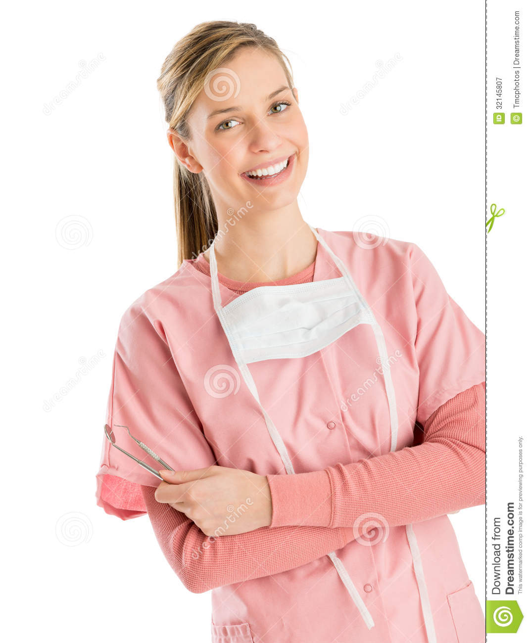 Portrait Of Young Female Dentist With Dental Equipments Standing Arms