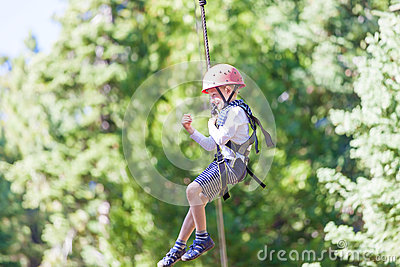 Ziplining At Outdoor Treetop Adventure Park Being Active And Brave