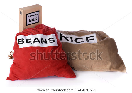 Box Of Powdered Milk And Large Bags Of Dried Beans And Rice To Be