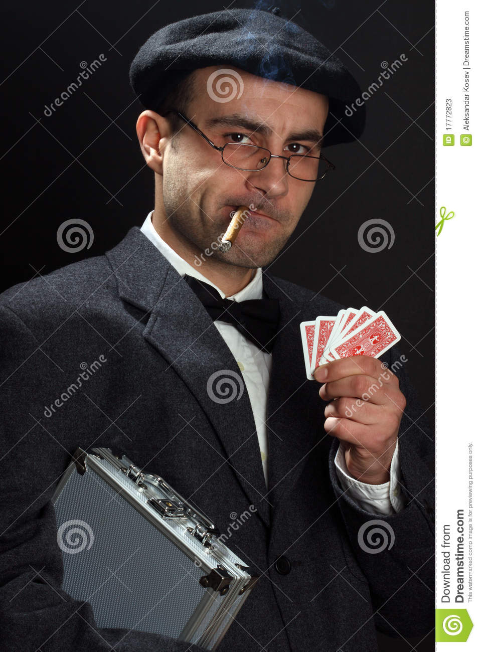 Portrait Of A Poker Player Over Black Background