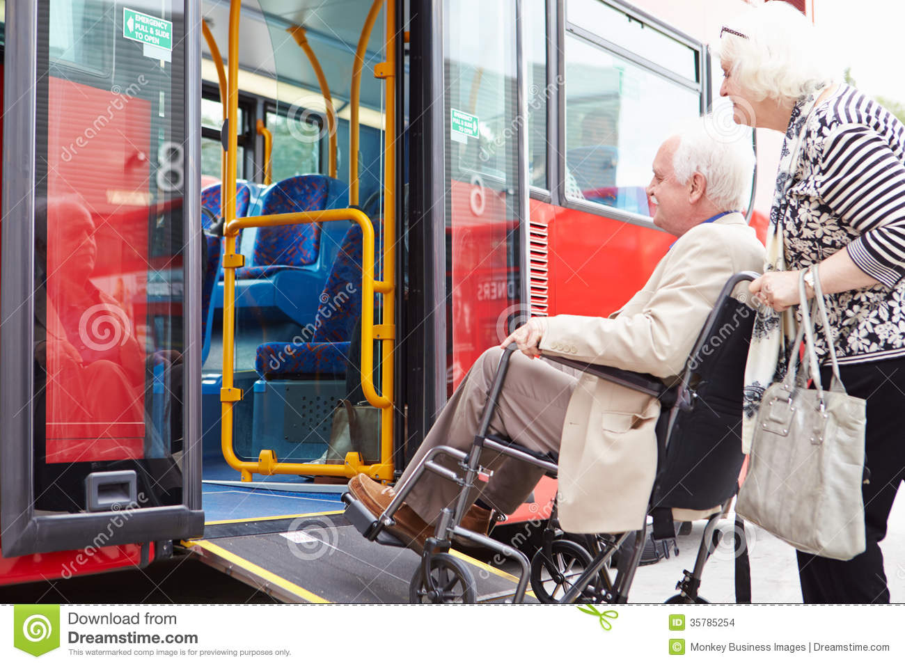 Senior Couple Boarding Bus Using Wheelchair Access Ramp Stock Images    