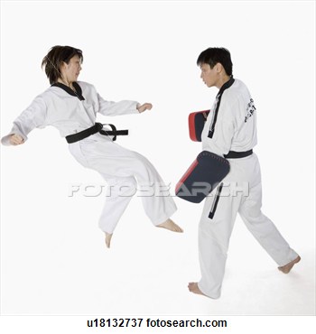 Female Karate Instructor Teaching Martial Arts To A Young Man View