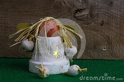 Christmas Decoration Homemade Angel From Ceramic Pot On Green Fabric    