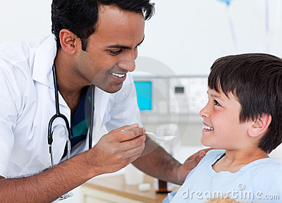 Handsome Doctor Giving Medicine To A Little Boy Royalty Free Stock    