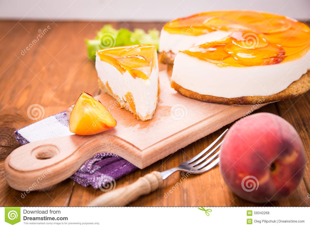 Peach Pie On Plate With Fresh Peaches And Lettuce In Studio 