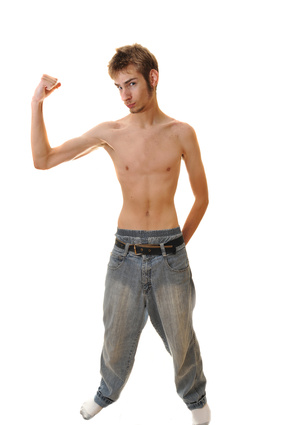 Hardgainer Is A Slender Young Man Flexing With No Shirt