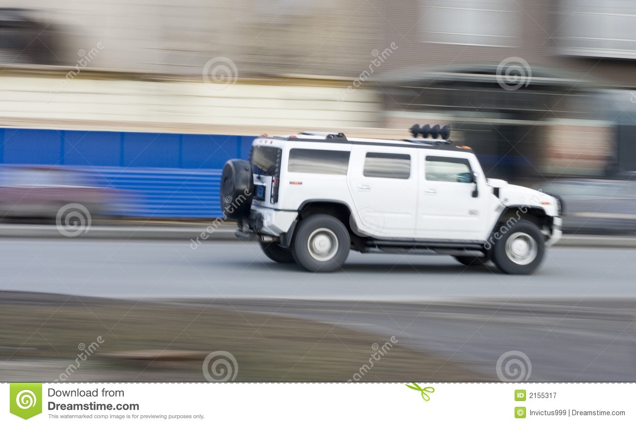 White Huge Hummer Suv Car Driving Fast Rushing Forward Royalty Free    