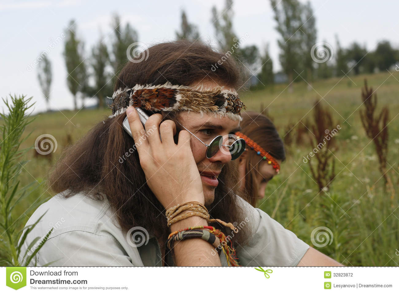 Stock Photography  Hippie Men Speak On The Mobile Phone