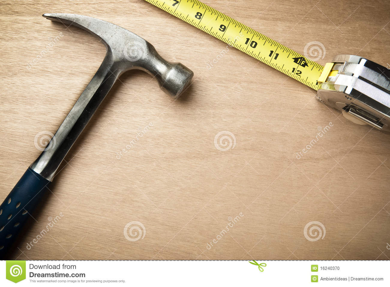 Hamer And Measuring Tape On Wood Background With Copy Space Beneath