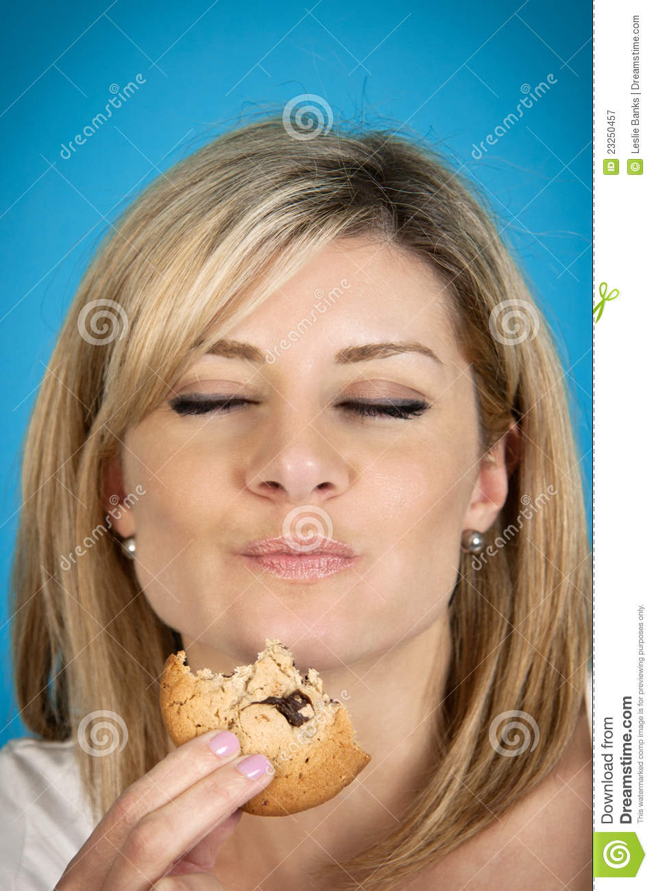 Woman Eating Cookie Royalty Free Stock Photography   Image  23250457