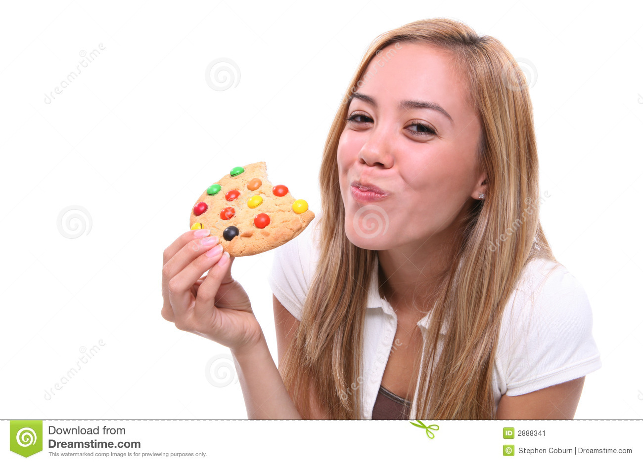 Young Pretty Girl Eating A Chocolate Chip Cookie Dessert