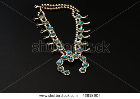 Closeup Of Native American Squash Blossom Necklace Isolated On Black