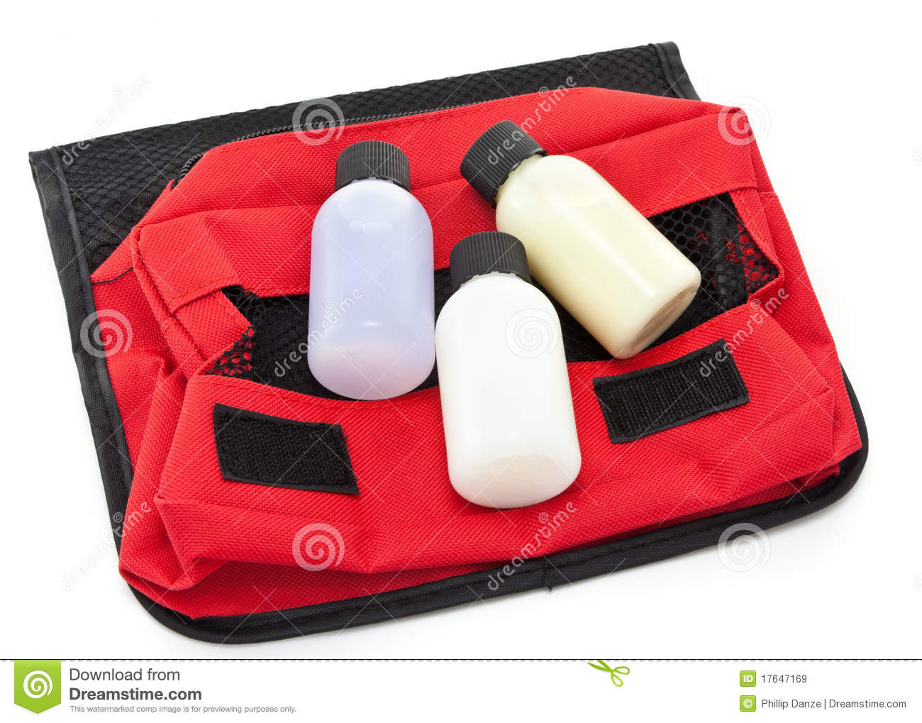 Three Travel Sized Toiletry Items On A Red Toiletries Bag