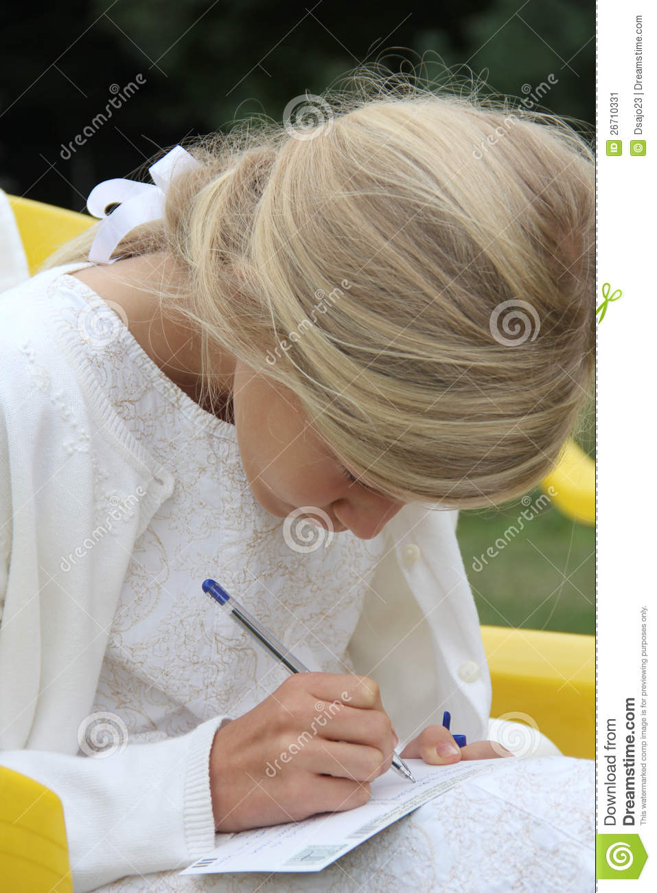 11 Year Old Pretty Blond Girl In White Dress Writing Her Best Wishes    