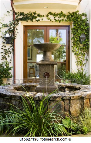 Stock Photography Of Rock Fountain In Spanish Style Courtyard