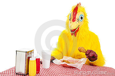 Man In A Chicken Suit Sitting Down To Eat A Fried Chicken Dinner