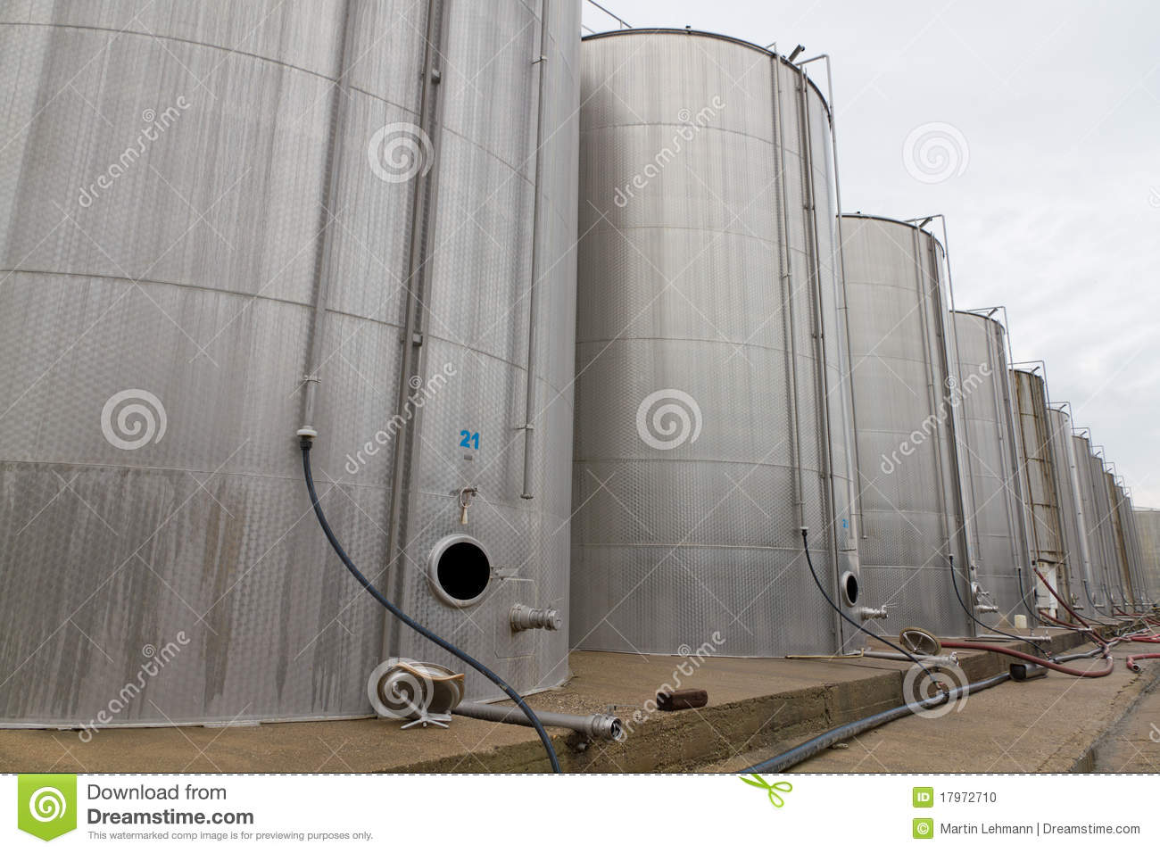 Rows Of Large Steel Tank Vessels On A Factory Yard For Storing Liquids