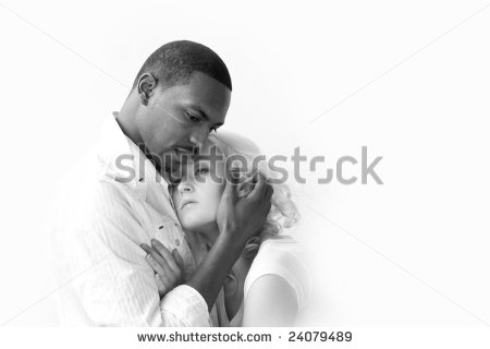 African American Man And Caucasian Woman Holding Each Other  Naturally