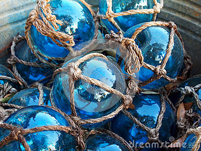 Glass Fishing Floats With Rope Knot Netting Piled In A Bucket