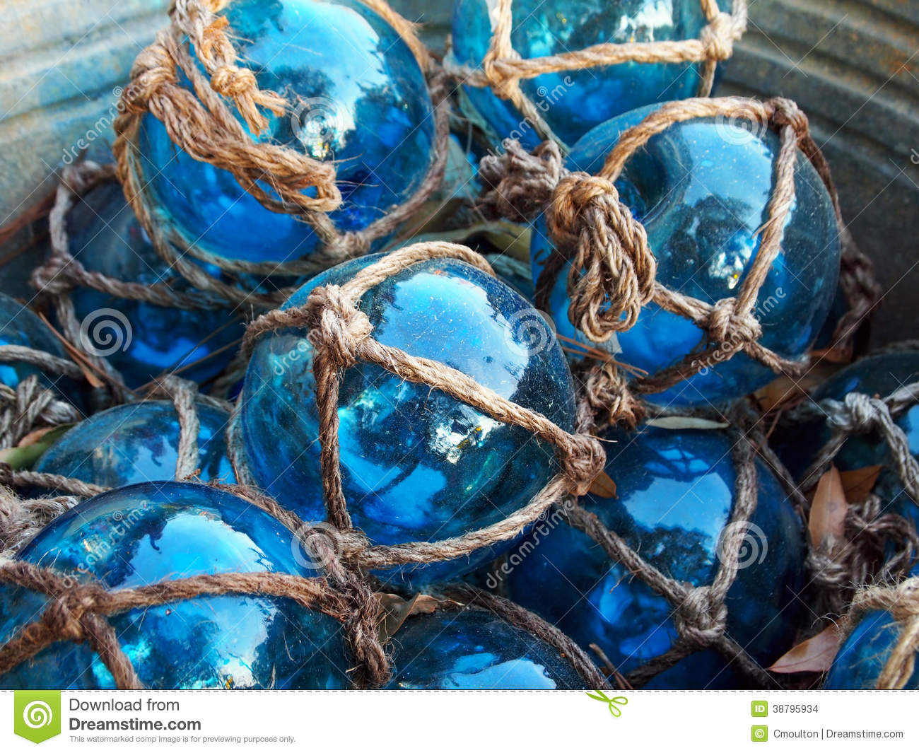 Glass Fishing Floats With Rope Knot Netting Piled In A Bucket