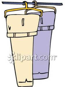 Two Pair Of Pants Hanging In A Closet   Royalty Free Clipart Picture