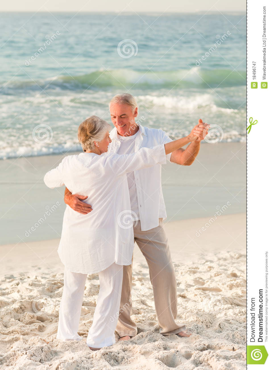 Royalty Free Stock Photography  Elderly Couple Dancing On The Beach