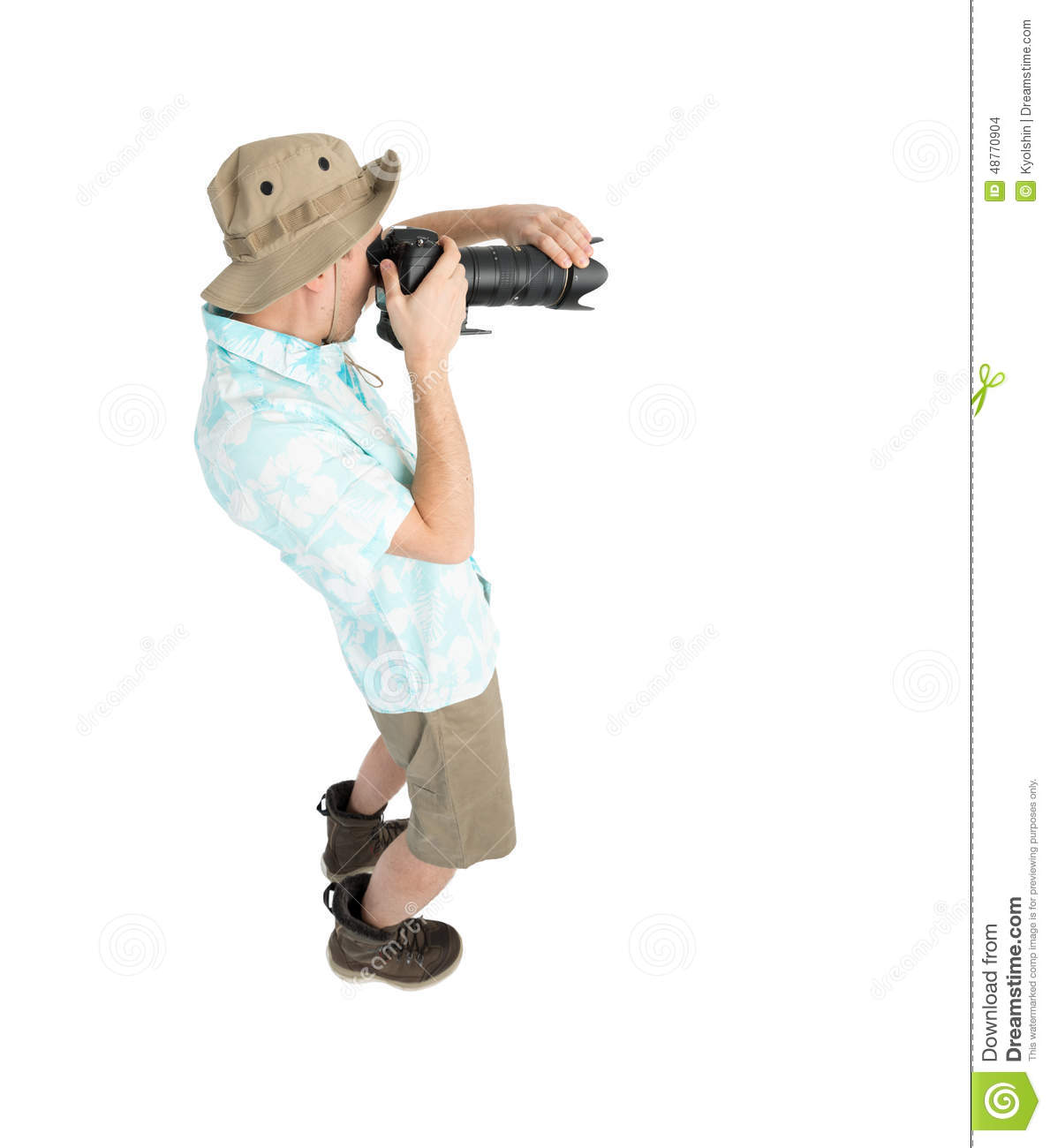 Silly Man Tourist In Blue Shirt Brown Shorts And Hat Holding Big Dslr