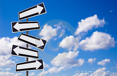 Multiple Directions Signs On Blue Sky Royalty Free Stock Photography