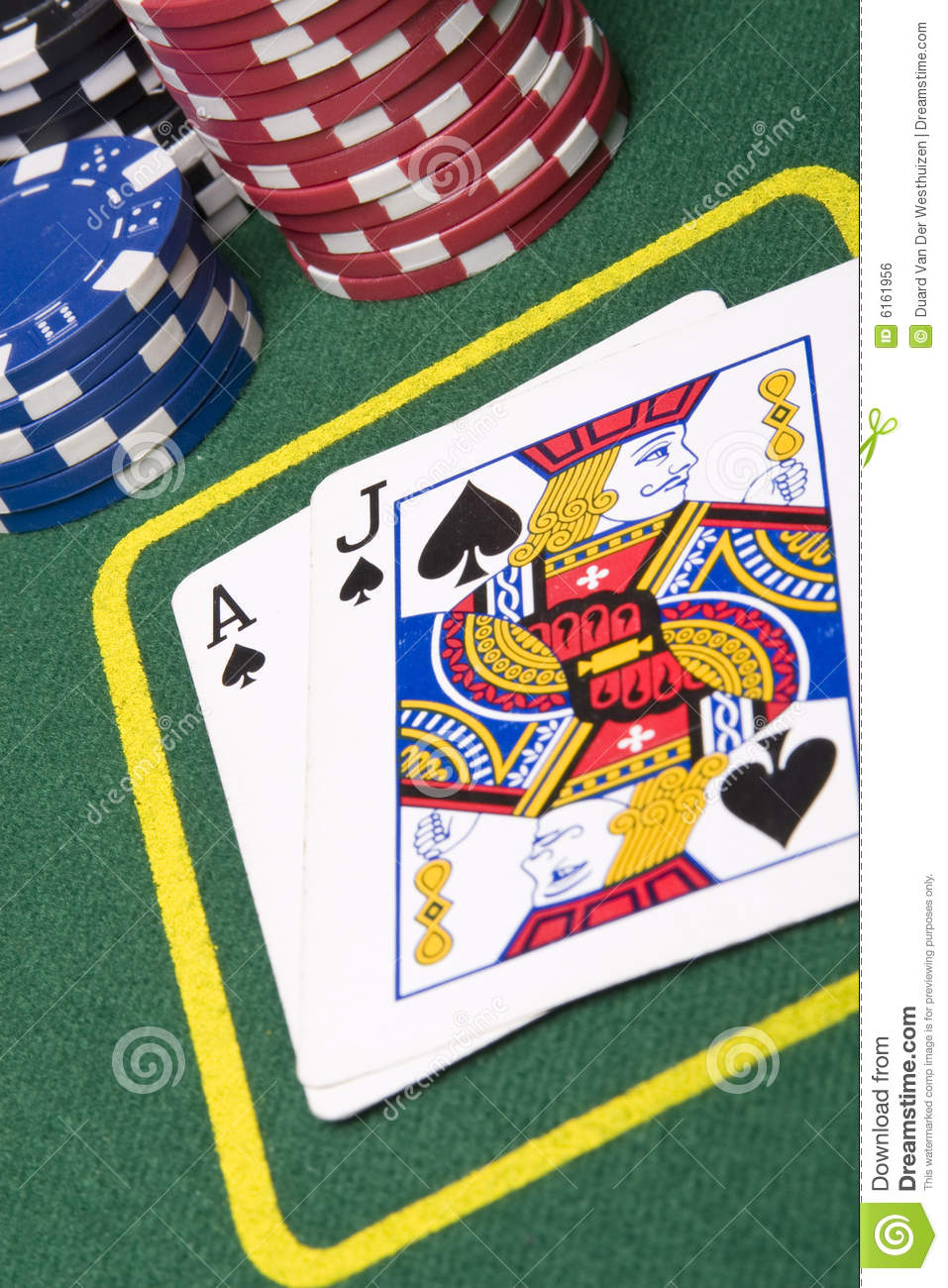 Game Of Blackjack At A Casino With Chips On A Green Blackjack Table