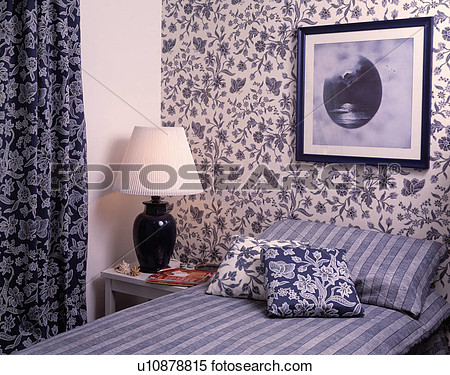 Bedroom With Picture And Blue White Floral Wallpaper Above Bed With