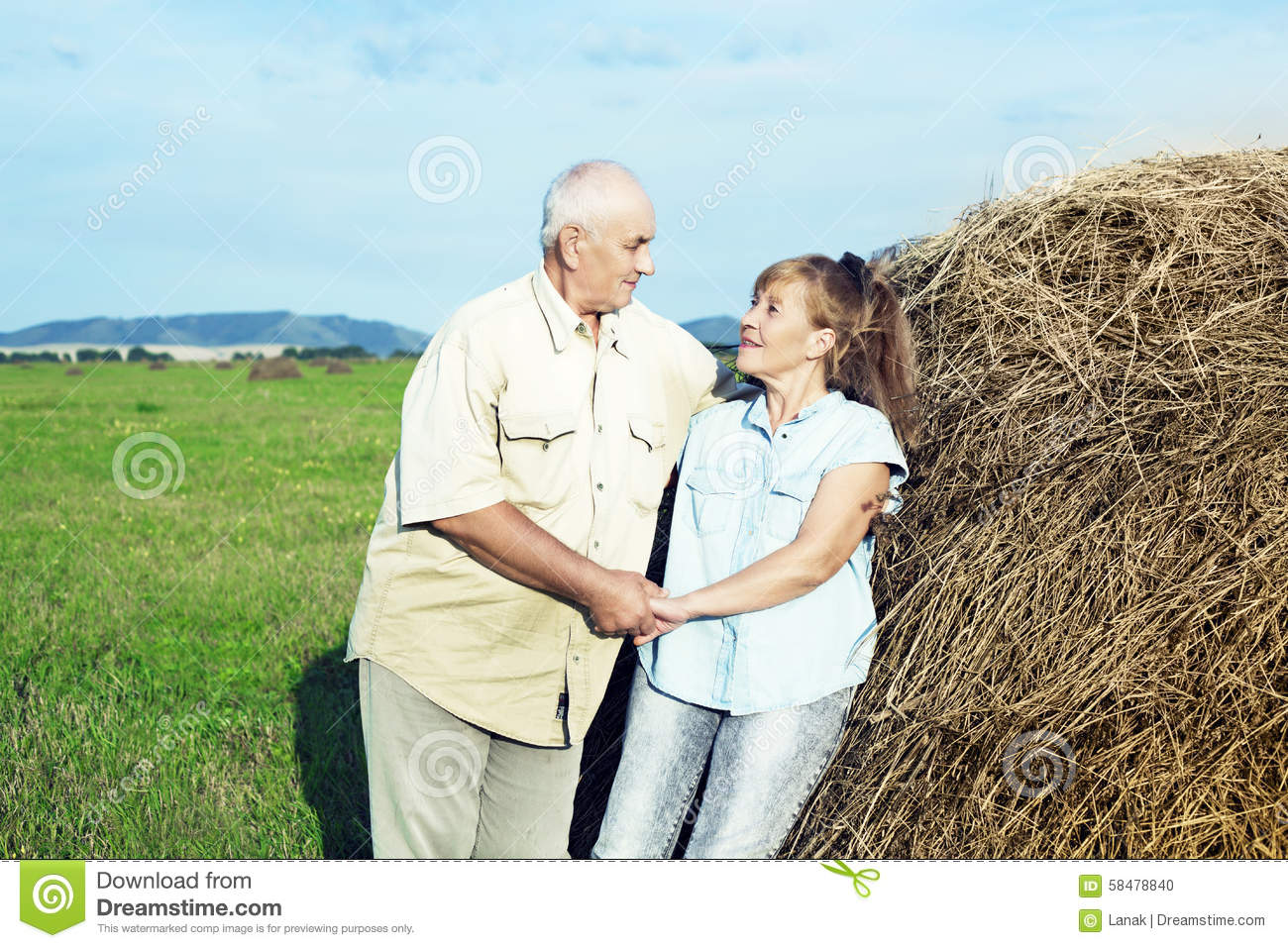 Happy Smiling Couple  68 Year Old Men And 65 Year Old Women Outdoor At