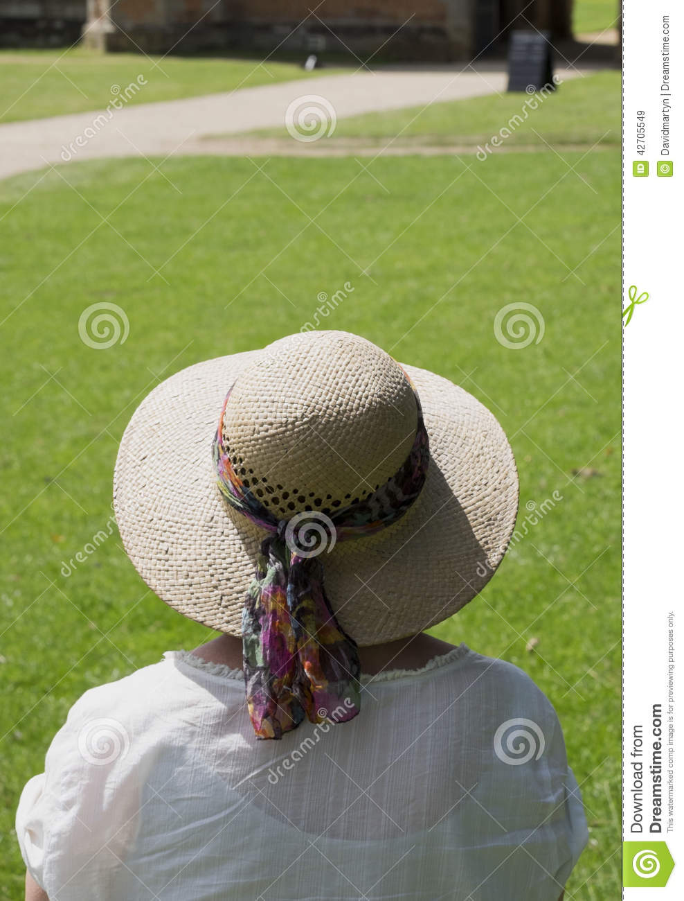 Senior 65 Year Old Woman With Straw Hat At Stately Home