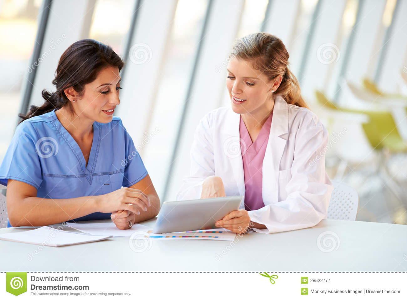 Female Doctor And Nurse Having Meeting Royalty Free Stock Photography