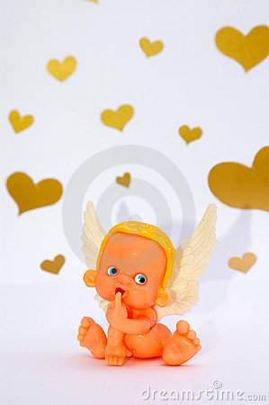 Funny Shy Toy Angel Puts His Finger In Mouth On White Background With
