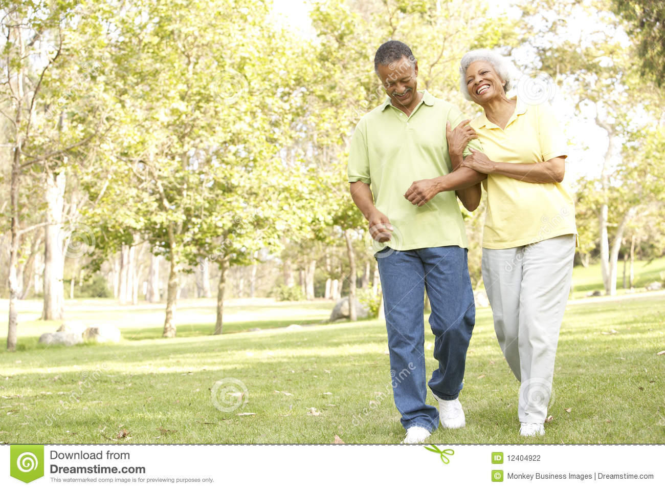 Senior Couple Walking In Park Stock Photography   Image  12404922