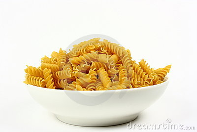 Filled With Uncooked Rotini Pasta Photographed On A White Background