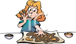 Girl Making Cookie Dough And Licking Chocolate From Her Fingers    