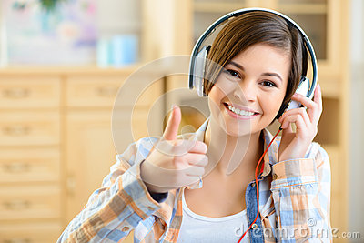 Listening To Music  Smiling Positive Teenage Girl Listening To Music
