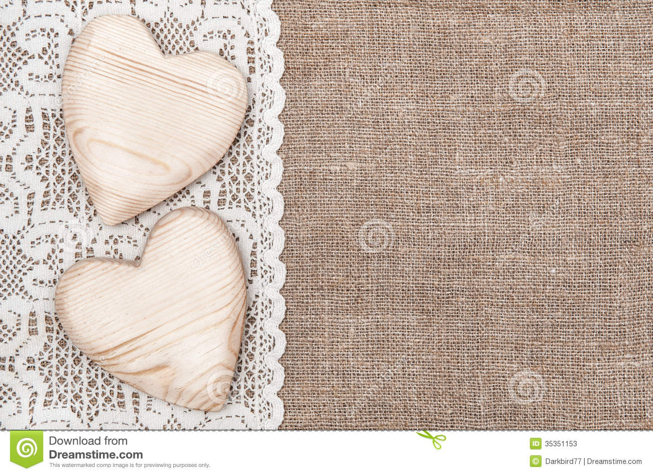 Burlap Background With White Lacy Cloth And Wooden Hearts